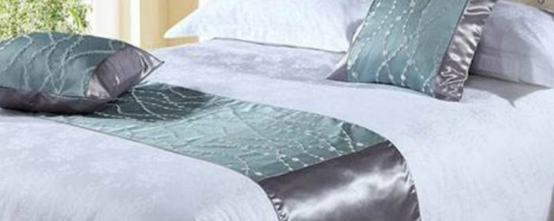 酒店床上的横条布是做什么用的 酒店床上的布条是干什么用的